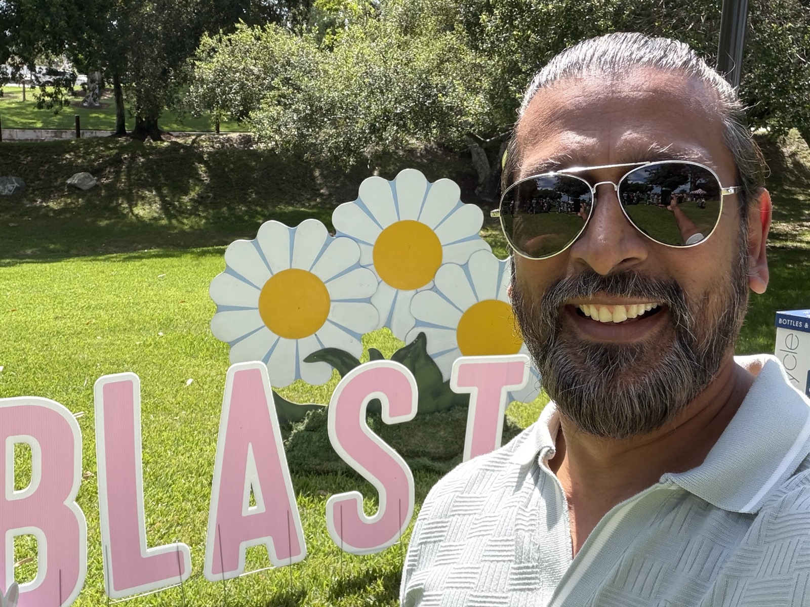 Anil Patel at a Lake Forest community event with BLAST lettering