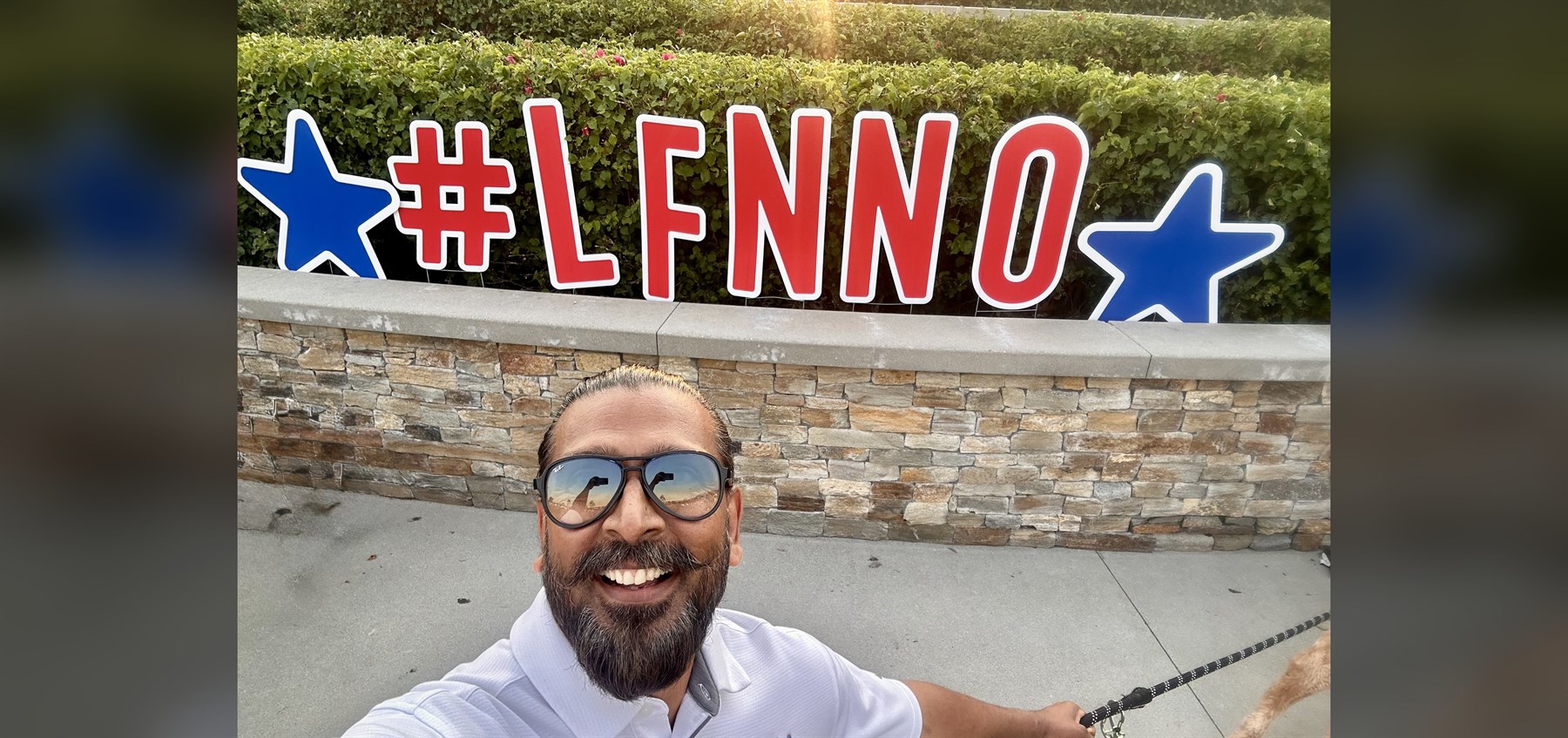 Anil Patel in front of a patriotic #LFNNO display